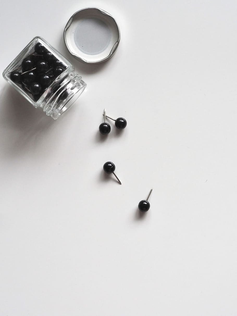 ball black pink lot beside container, black head pins on white surface with jar, HD wallpaper
