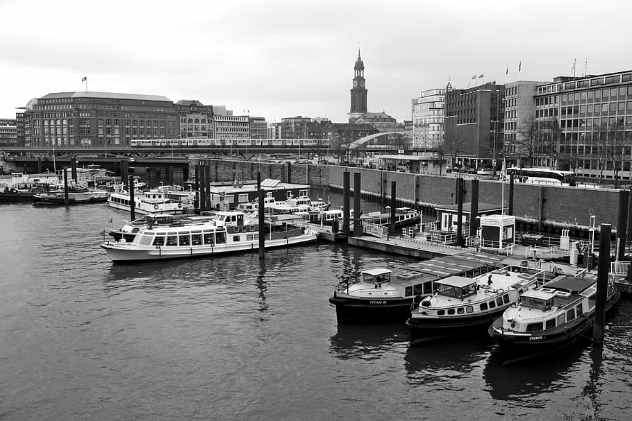 grayscale photography of boats on dock near buildings during daytime HD wallpaper