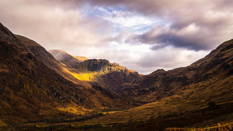 landscape photography of mountain trail, brown mountain under cloudy sky HD wallpaper