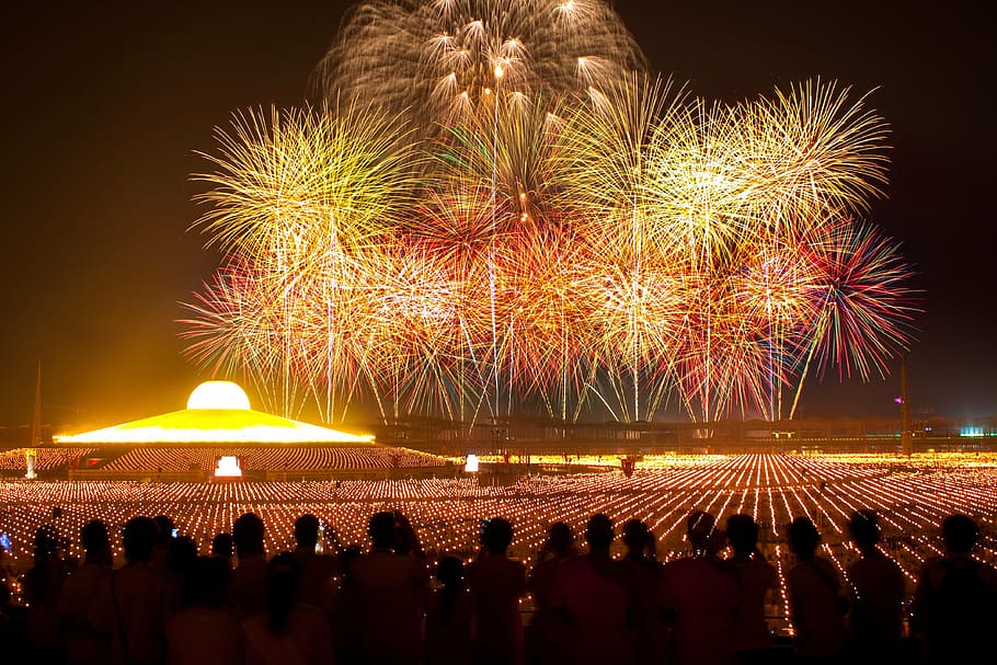 time lapse photography of people looking at fireworks display