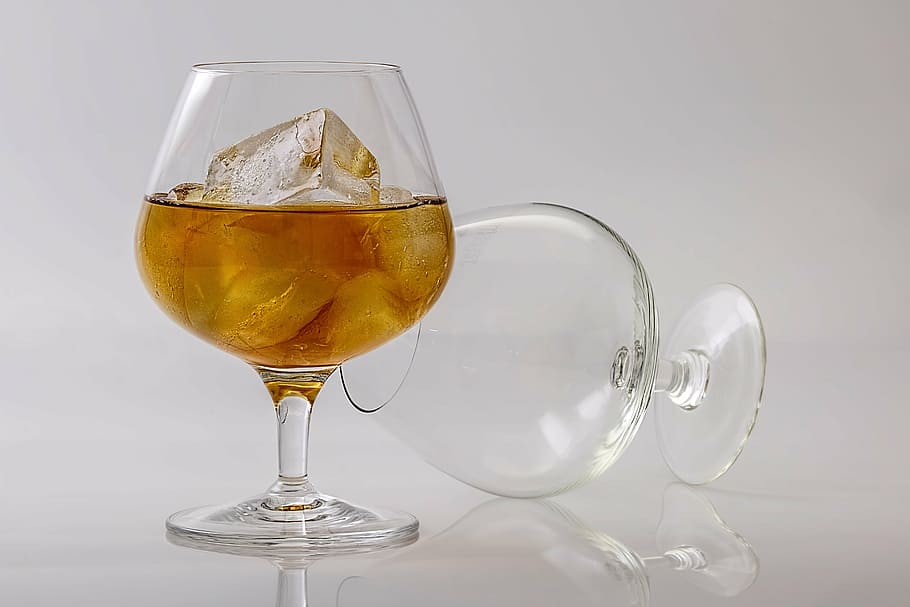 clear wine glass with half-filled with liquor and ice, brandy HD wallpaper