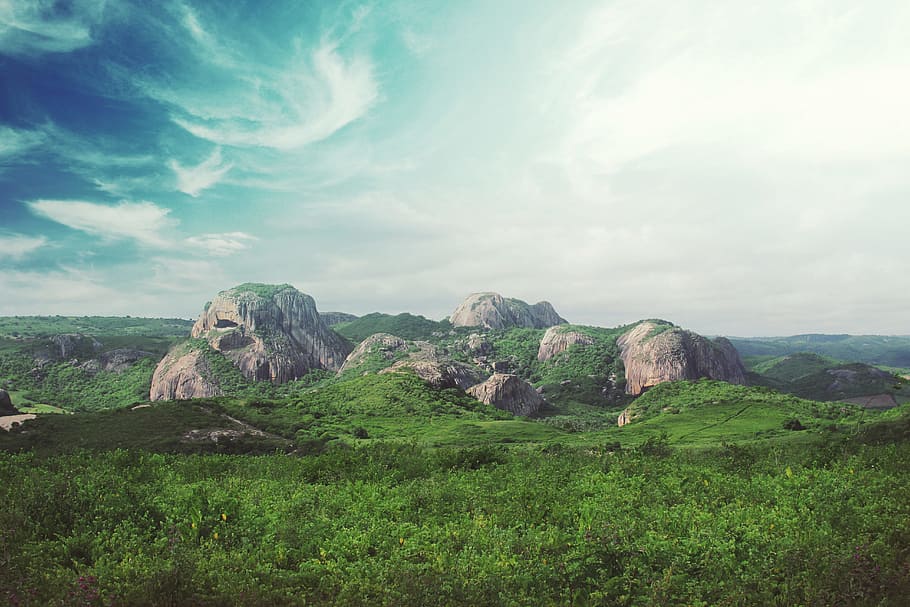 rocks surrounded by green field under blu sky, gray rock mountain HD wallpaper