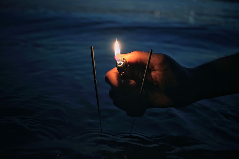person lighting incense, person about to light sparklers, flame HD wallpaper