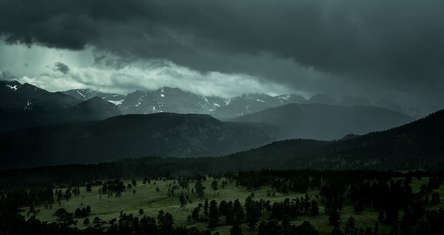 silhouette mountains under cloudy sky, aerial view of green grass field under nimbus clouds HD wallpaper