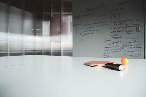 red and black ping pong racket with orange ball, white board HD wallpaper