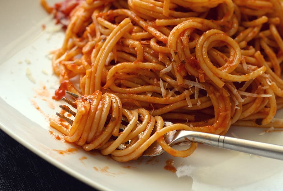 stainless steel fork on white ceramic plate, pasta, spaghetti