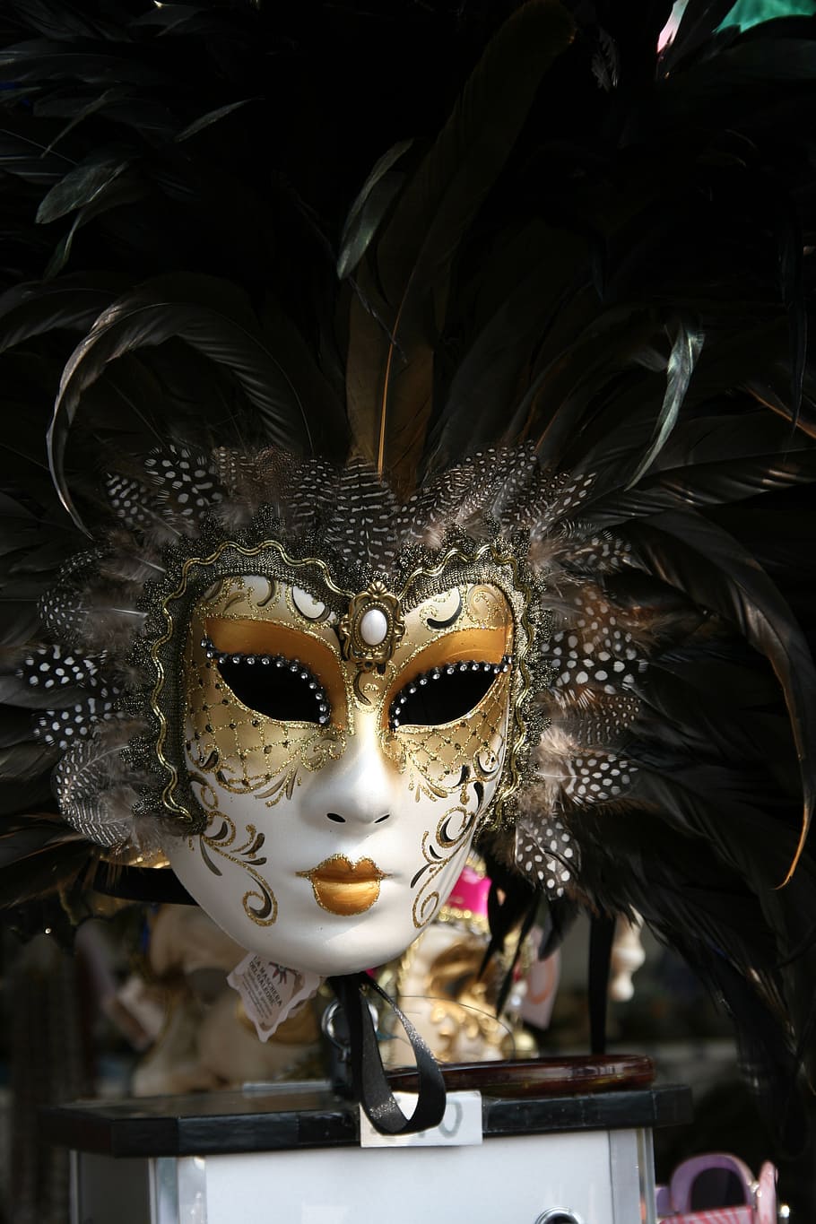 selective focus of white and gold masquerade, venetian mask, venice
