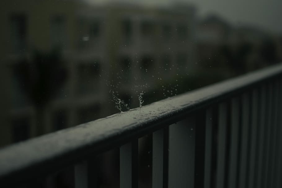 timelapse photo of water drop on black wooden fence, shallow focus photo of raindrops on black steel fence HD wallpaper