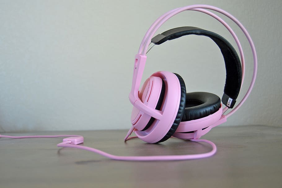 closeup photo of pink corded headphones on wooden panel, mic HD wallpaper