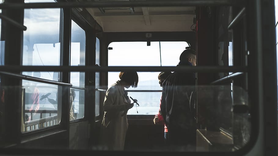 woman and man inside cable car, woman in white top, person, commuter HD wallpaper