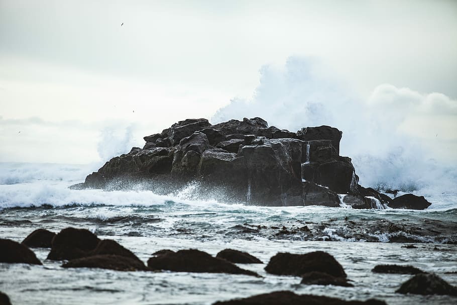 rock formations and body water, rock formation near ocean at daytime HD wallpaper