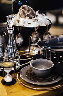 Fancy restaurant dinner table decorated with quail eggs and feathers HD wallpaper
