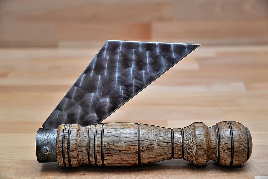 brown handled folding knife on brown wooden surface, model HD wallpaper