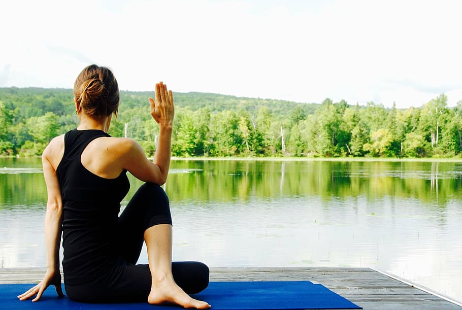 woman doing yoga beside body of water, nature, landscape, meditate