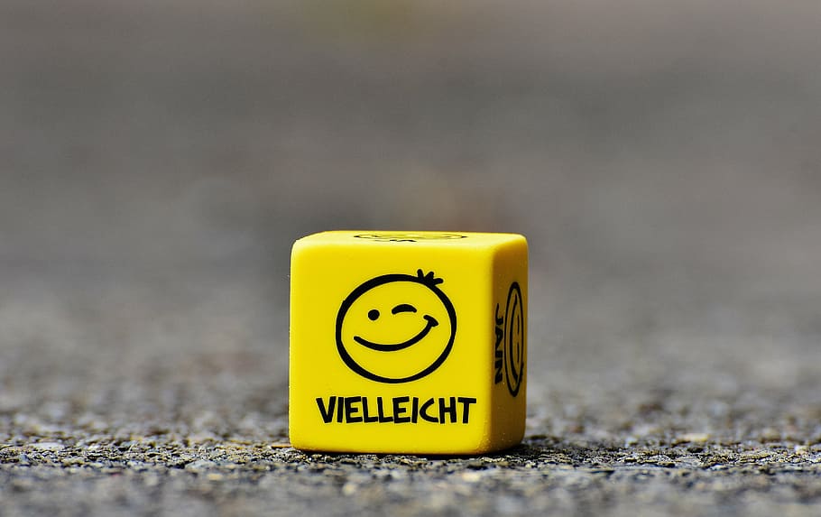 yellow and black Viellekht cube on gray surface, smiley, maybe HD wallpaper