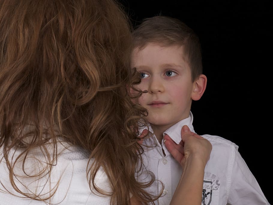 boy wearing white collared shirt standing near woman wearing white shirt HD wallpaper