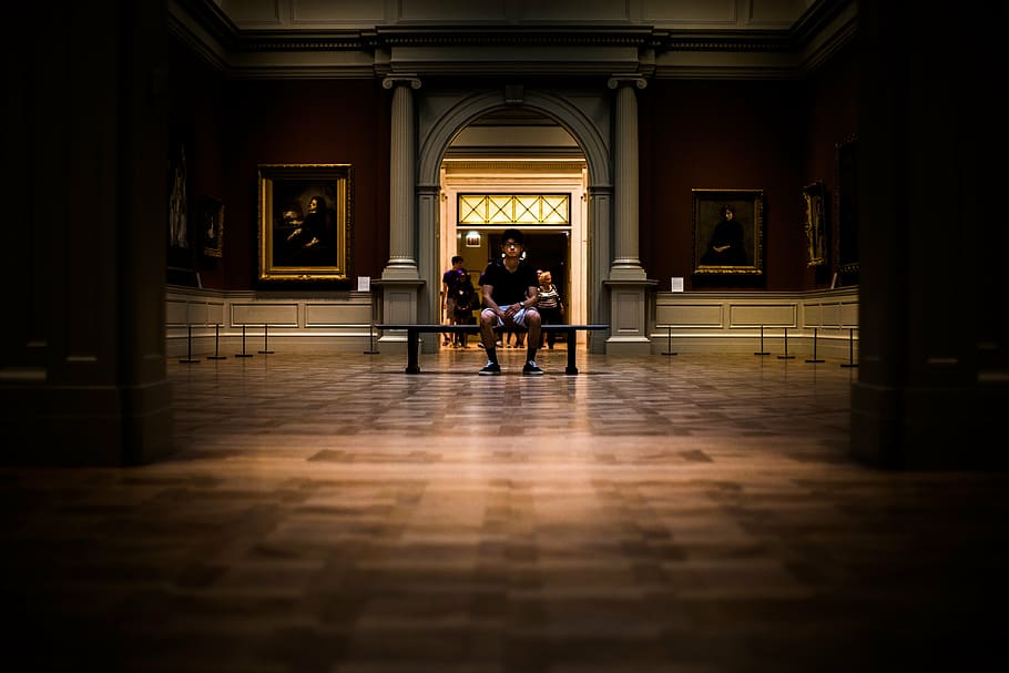 man sitting on chair inside building, people, alone, museum HD wallpaper