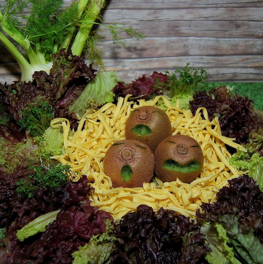 three kiwi fruits surrounded with leaves, vegetables, salad HD wallpaper