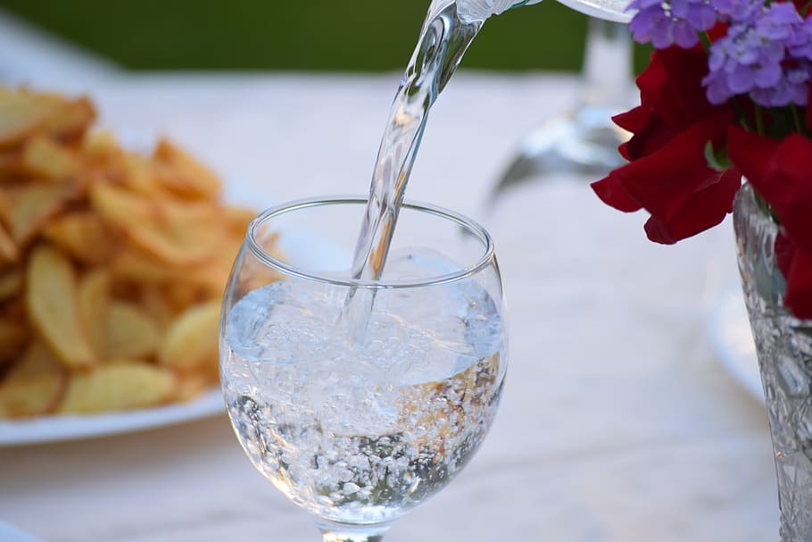 water pouring on wine glass, bottle, mineral water, bottle of water
