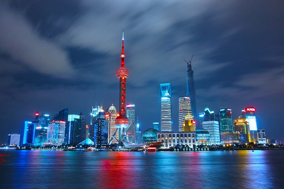 architectural photograph of lighted city sky, skyline photography of Oriental Tower in China under blue sky HD wallpaper