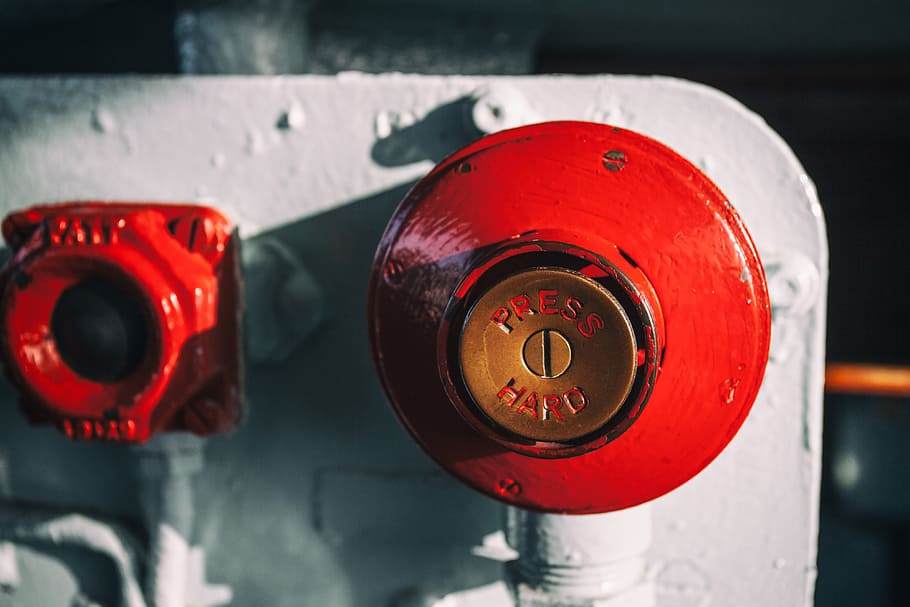 Close-up shot of a big red button, this image was captured on an old warship in Chatham Dockyard in Kent, England, HD wallpaper