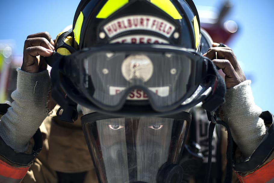 selective focus photography of person wearing snow goggles, firefighter
