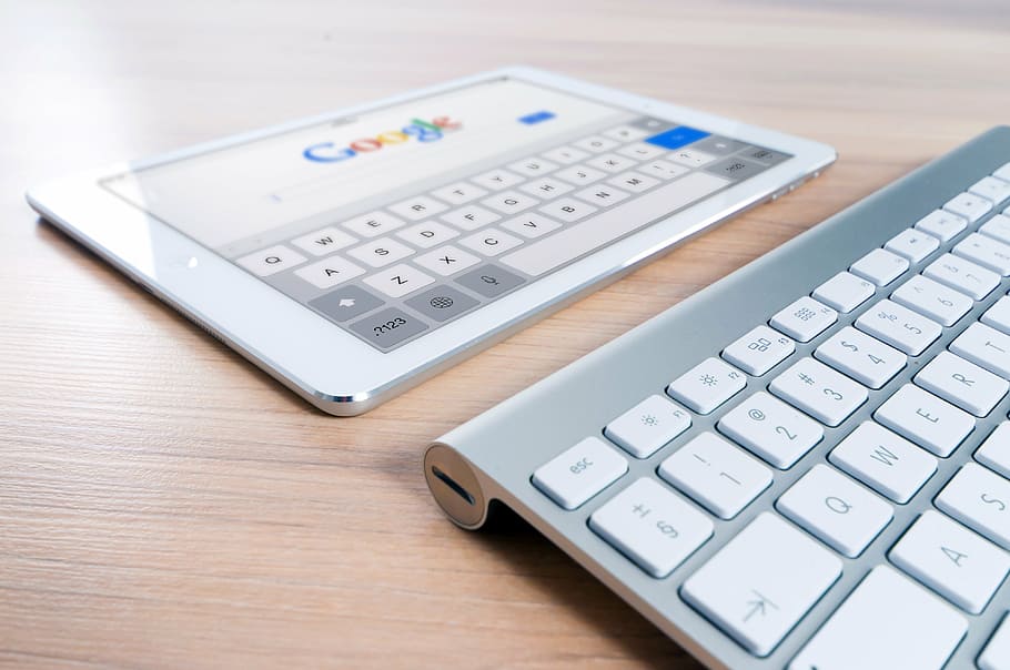 white iPad showing Google, pro, near, magic, keyboard, brown HD wallpaper
