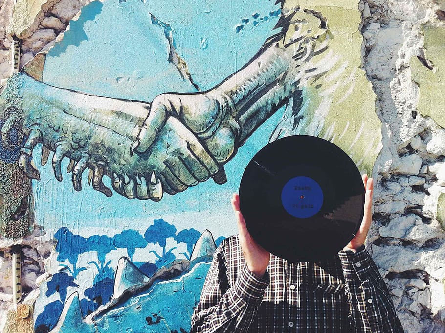 painting of shake hands, man holding vinyl in front of two person shaking their hands painting HD wallpaper