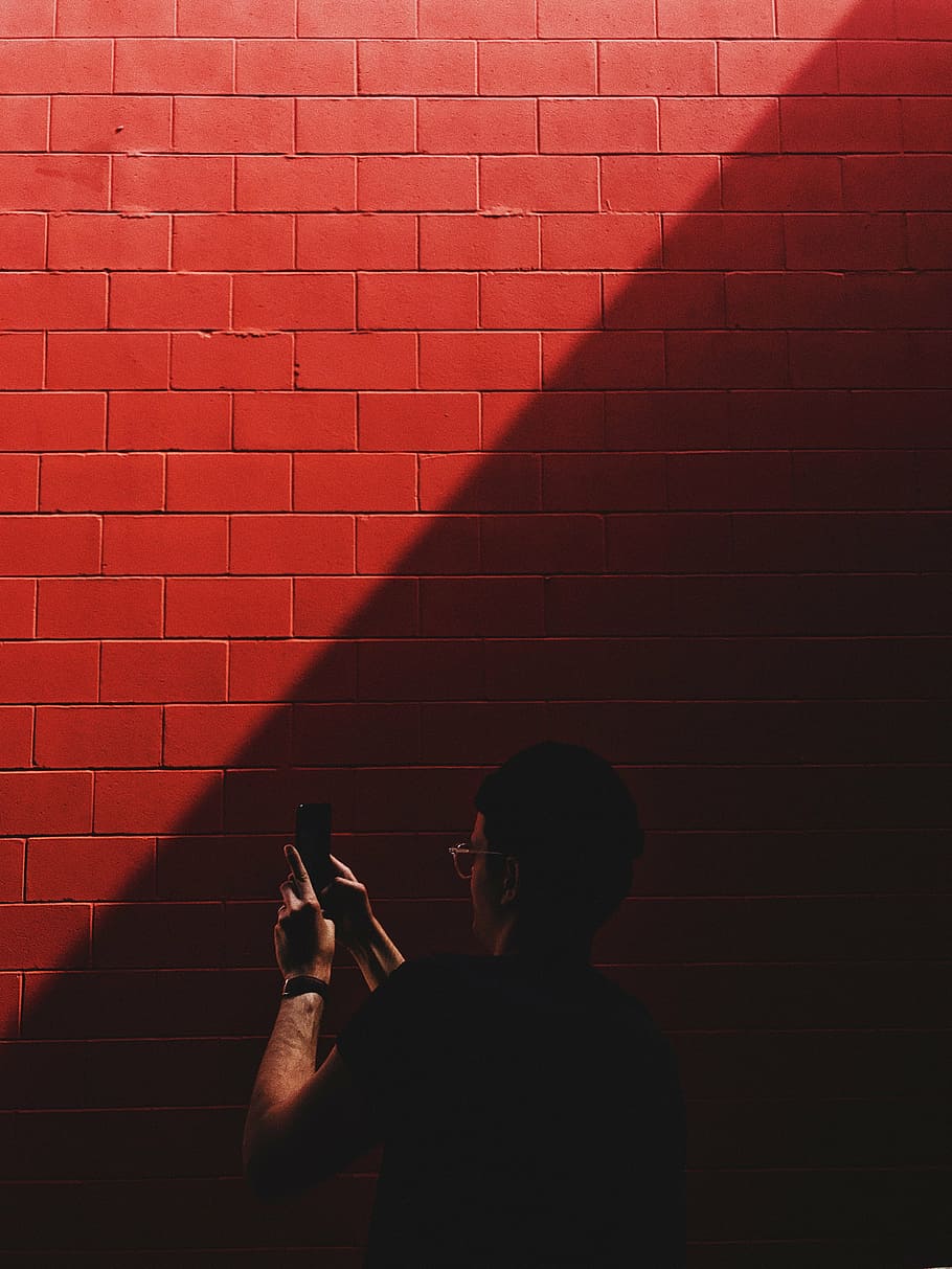 red wall cladding, sunlight, dark, people, man, guy, mobile HD wallpaper