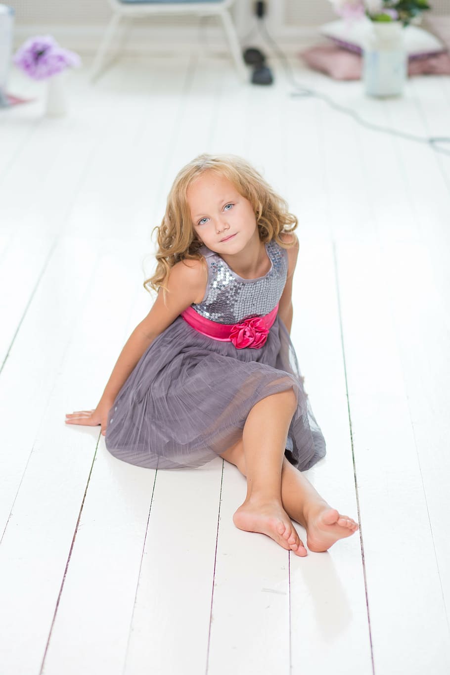 girl in gray dress sitting on white wooden floor, young, room