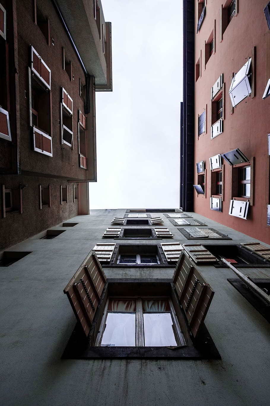 low angle photography of building with open windows at daytime, worms eye view photo of building HD wallpaper