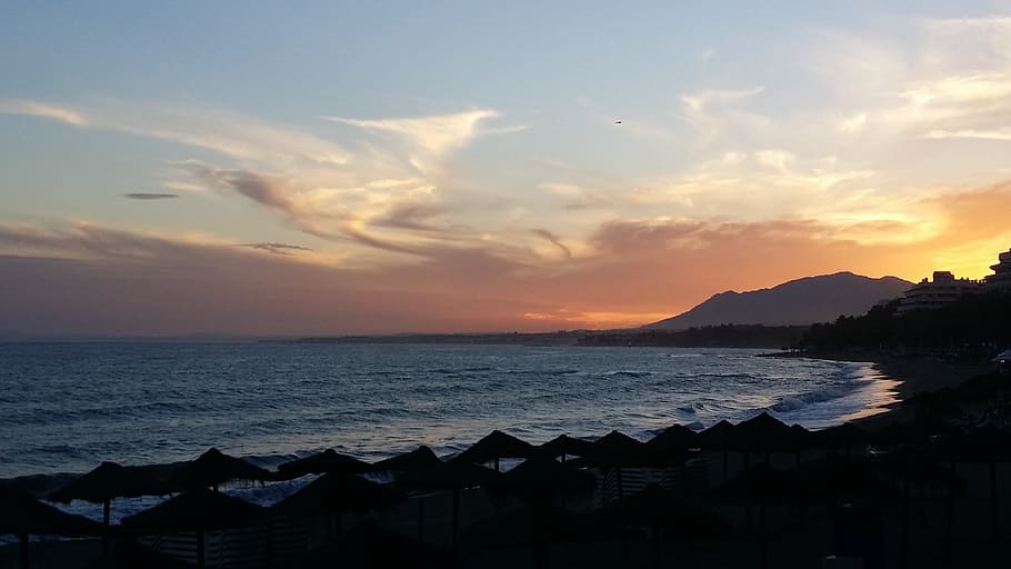 sunset, calm clouds, beach, mountains, orange sky, evening sky HD wallpaper