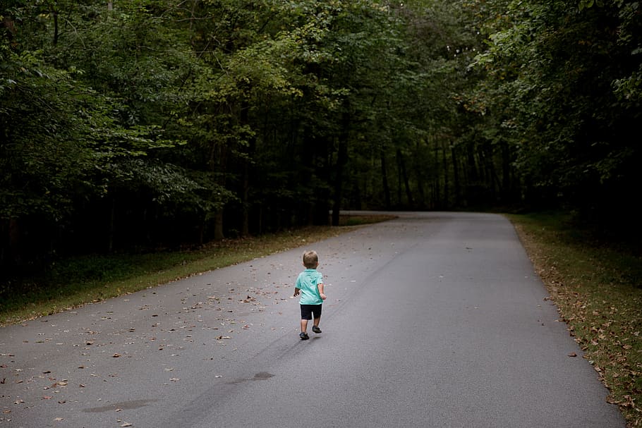 boy running on road, mid, forest, asphalt, day, time, path, people
