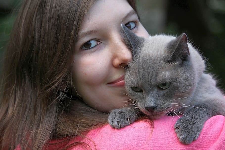 woman carrying gray cat, portrait, cute, young, friendship, of course