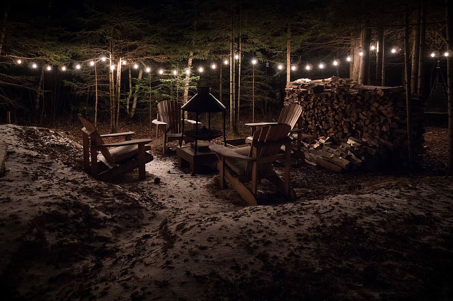 brown wooden adirondack chair on night time, four brown adirondack chairs in forest HD wallpaper