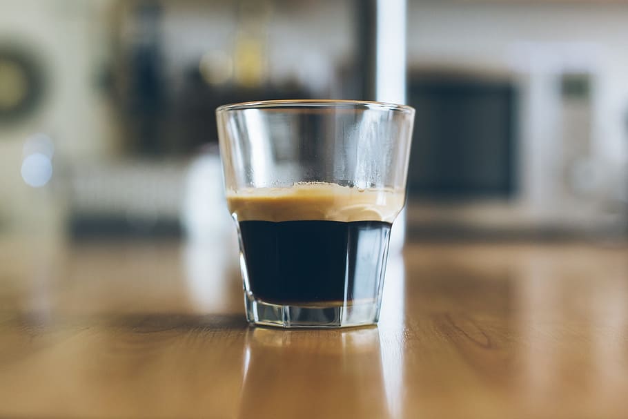 clear drinking glass on top of brown wooden table, espresso HD wallpaper