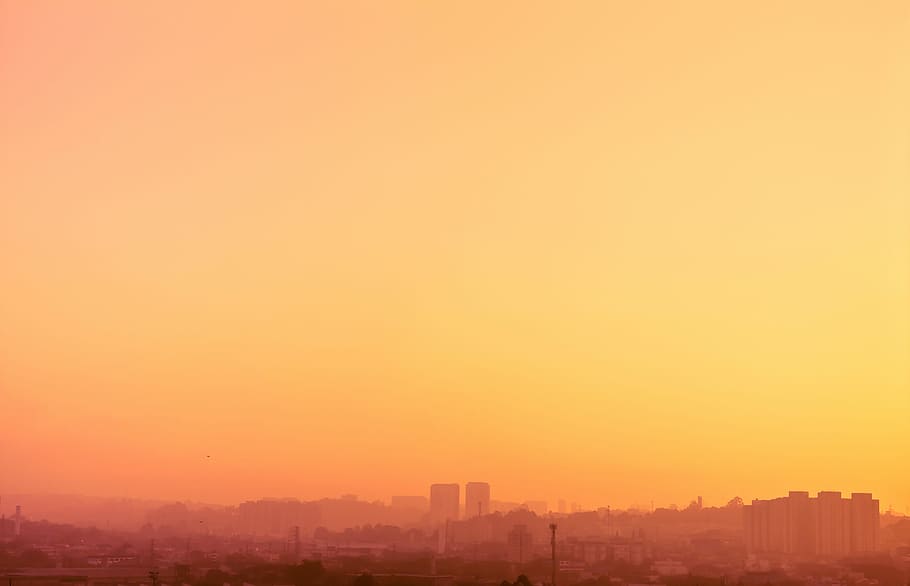 city building during sunset, panorama photo of city during golden hour HD wallpaper