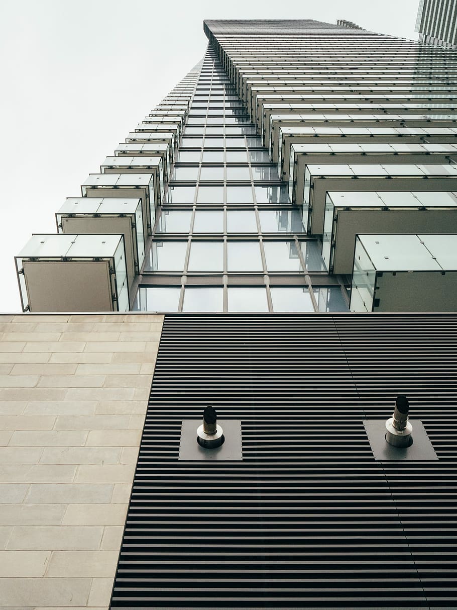 worm's-eye view of skyscraper, black and brown building during daytime HD wallpaper