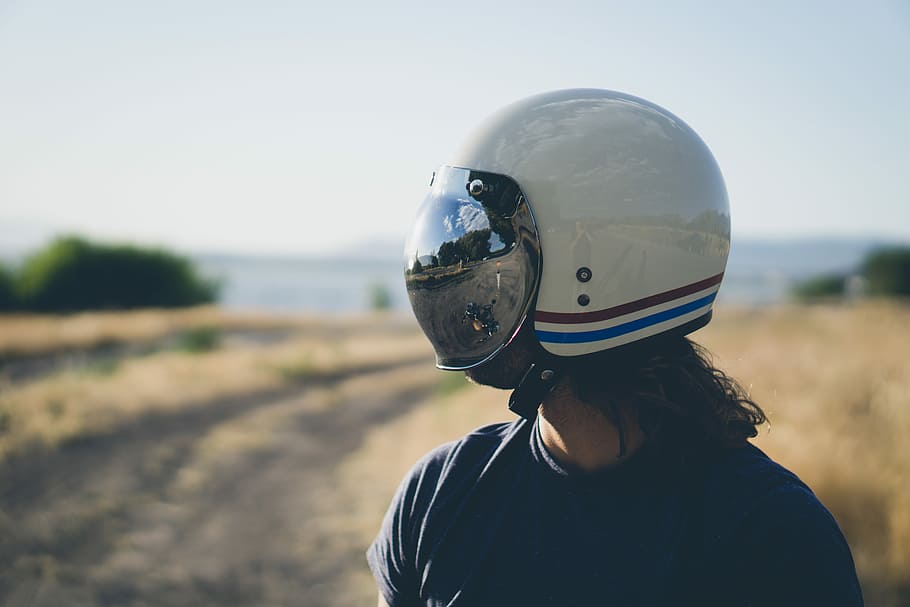 person wearing white, red, and blues tripe half-face helmet during daytime HD wallpaper