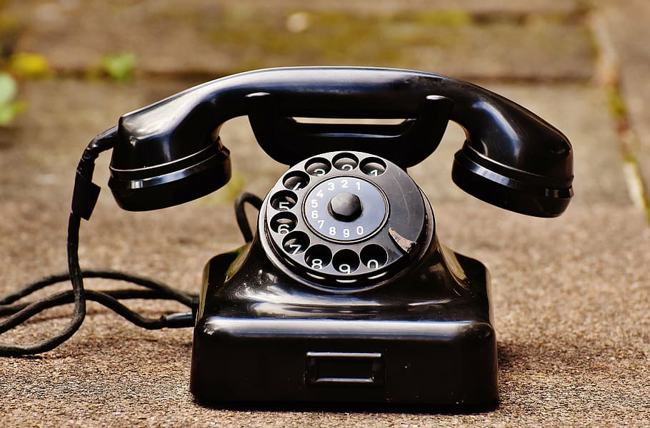 black rotary telephone on gray concrete flooring, old, year built 1955 HD wallpaper