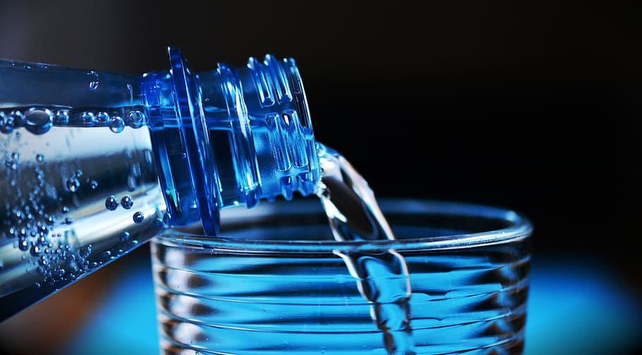Close-up of Bottle Pouring Water on Glass, blue, container, drink