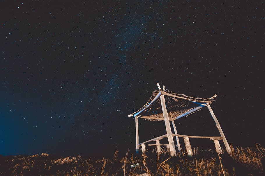 bottom view of wooden hut and starry sky, brown hut under the starry night HD wallpaper