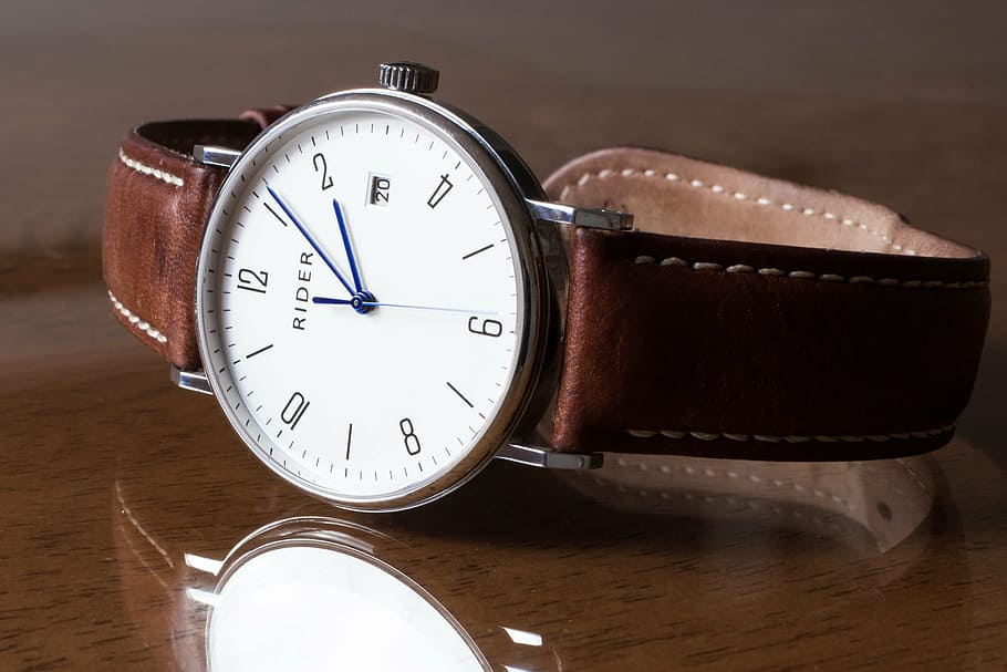 round silver-colored analog watch with brown leather strap on brown wooden surface, HD wallpaper