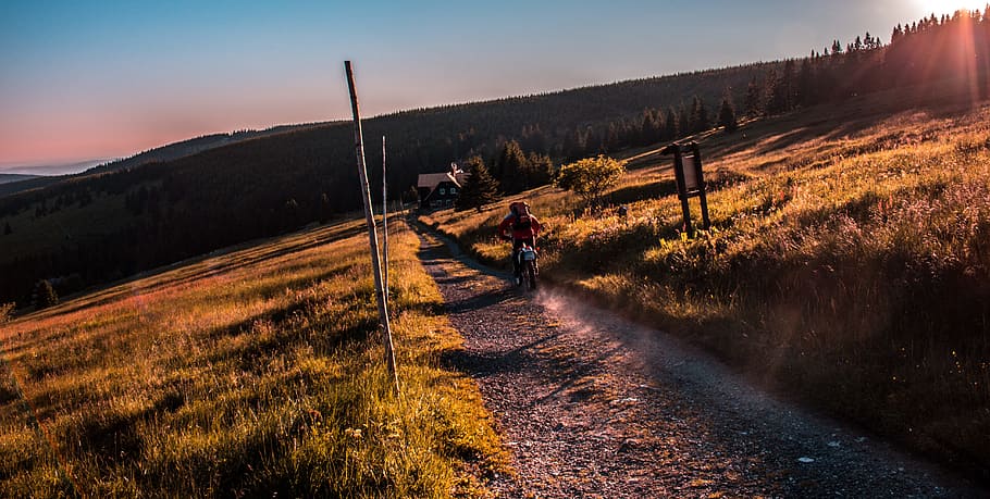 person motorcycling on pathway, person riding motorcycle on dirt road HD wallpaper