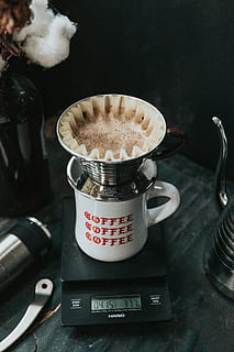 white ceramic mug on black pocket scale, white and red coffee-printed ceramic mug on black Hario scale HD wallpaper