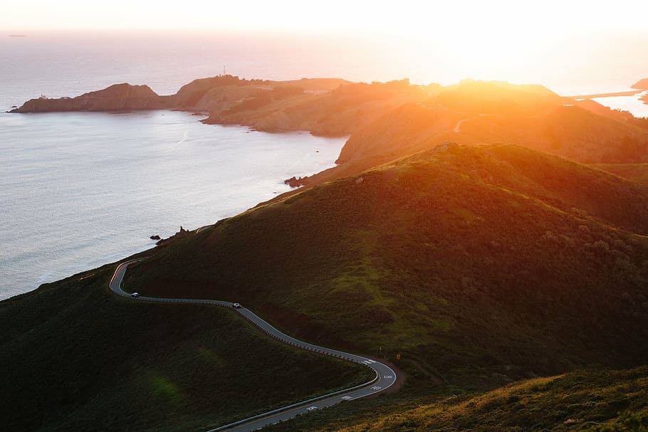 seaside hills with road during sunrise, mountain, highland HD wallpaper