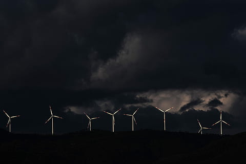 eight white wind turbines, white windmills on black mountains under gray cloudy sky HD wallpaper