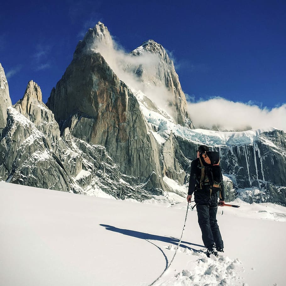 man in black coat on alps mountain, snow, sport, winter, outdoors HD wallpaper