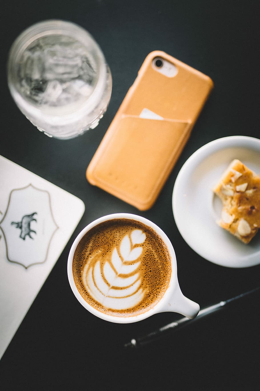 selective focus photo of cup of cappuccino beside smartphone, saucer, and glass, flat-way photography of latte on cup beside iPhone and cookie, HD wallpaper