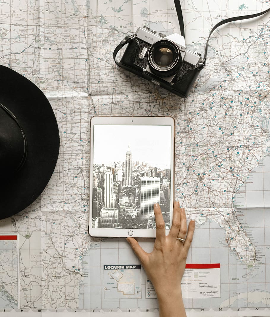 person holding iPad beside SLR camera, person using gold iPad beside black and gray camera HD wallpaper